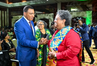 Prime Minister, Dr. the Most Hon. Andrew Holness (left), greets Prime Minister of Barbados, Hon. Mia Mottley, at Sunday’s (July 6) opening ceremony of the 49th Meeting of the Conference of Heads of Government of CARICOM, currently in progress at the Montego Bay Convention Centre in Rose Hall, St. James.

