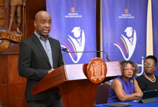 Education Transformation Oversight Committee (ETOC) Chairman, Dr. Adrian Stokes (at podium), addresses Wednesday’s (July 23) ETOC Press Conference at Jamaica House. Listening (from left) are Minister of Education, Skills, Youth and Information, Senator Dr. the Hon. Dana Morris Dixon, and Transforming Education for National Development (TREND) Project Lead, Dr. Venesse Morrison-Leon.