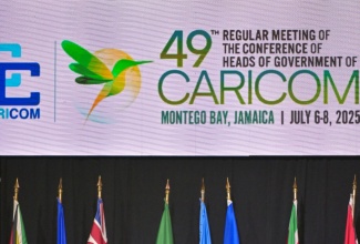 Youth advocate , Dr. Aubrey Stewart, gives remarks during the opening ceremony of the 49th Regular Meeting of the Conference of Heads of Government of the Caribbean Community (CARICOM), held on Sunday (July 6) at the Montego Bay Convention Centre in St. James. 

