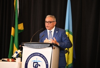 Prime Minister of Belize, Hon. John Briceno, gives remarks during the swearing-in ceremony for the new President of the Caribbean Court of Justice (CCJ), Hon. Mr. Justice Winston Anderson, a Jamaican, on Sunday (July 6) at the Jewel Grande Resort Montego Bay, St. James.