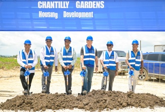 Prime Minister, Dr. the Most Hon. Andrew Holness, (third right) breaks ground for the National Housing Trust's (NHT) Chantilly Garden's housing development in Westmoreland on Friday (July 18). The Prime Minister is joined by (from left) Director at Grange Solutions Limited, Junior Lavine;  Managing Director at the NHT, Martin Miller; Member of Parliament for Westmoreland Central, George Wright; Chairman at the NHT, Linval Freeman and Director at Grange Solution Limited, Michael Levine