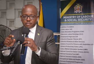 Minister of Labour and Social Security, Hon. Pearnel Charles Jr., addresses workers departing the island on Tuesday (July 15) to take up employment opportunities in Canada under the Seasonal Agricultural Workers Programme, during a ceremony at the Ministry’s Overseas Employment Centre on East Street in downtown Kingston.