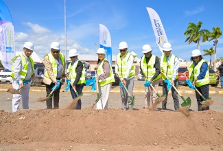 Minister of Health and Wellness Dr. the Hon. Christopher Tufton (fourth right) breaks ground for the new outpatient department building at the May Pen Hospital in Clarendon. Also participating are (from left) Chairman of the May Pen Hospital Management Committee, William Shagoury; Southern Regional Health Authority (SRHA) Regional Director, Michael Bent; Chief Executive Officer (CEO) of May Pen Hospital, Eugena Clarke-James; Custos Rotulorum for Clarendon, Hon. Edith Chin; Mayor of May Pen, Councillor Joel Williams; SRHA Board Chairman, Wayne Chen; and Chief Medical Officer, Dr. Jacquiline Bisasor-McKenzie. The facility will be constructed at a cost of $642 million, providing care to more than 2,500 people monthly. Construction is expected to take approximately 16 months.