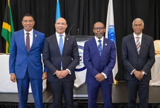 Governor General, His Excellency the Most Hon. Patrick Allen (second left); Prime Minister, Dr. the Most Hon. Andrew Holness (left), and outgoing President, Caribbean Court of Justice (CCJ), Hon. Mr. Justice Adrian Saunders (right), share a photo opportunity with newly appointed CCJ President, Hon. Mr. Justice Winston Anderson, during the Swearing-in Ceremony at the Jewel Grande Hotel in Montego Bay, St. James, on Sunday (July 6).

