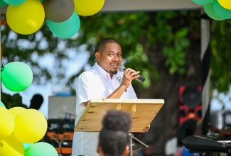 Minister of Agriculture, Fisheries and Mining, Hon. Floyd Green delivers the keynote address during the recent St. Thomas Agricultural Show at the Rudolph Elder Park in Morant Bay.