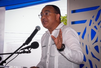 Member of Parliament for St. Catherine West Central, Dr. the Hon. Christopher Tufton, addresses the recent official opening of the Green Acres Police Station in the parish.

