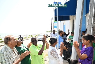 Minister of Local Government and Community Development, Hon. Desmond McKenzie (second left), walks along the newly renamed School Street —now CD Wright Road—following a ceremony in Black River, St. Elizabeth, on Friday (July 4). He is joined by (from left) Mayor of Black River and Chairman of the St. Elizabeth Municipal Corporation, Councillor Richard Solomon; and Minister of Agriculture, Fisheries and Mining and Member of Parliament for St. Elizabeth South Western, Hon. Floyd Green.