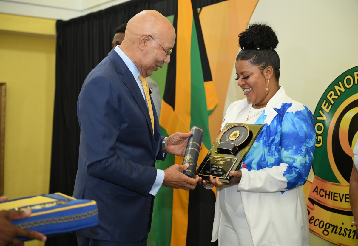 Governor-General, His Excellency the Most Hon. Sir Patrick Allen (left), presents Westwood High School Mathematics teacher Kimberly Todd with her award at the 2025 Governor-General’s Achievement Awards (GGAA) ceremony, held at King’s House on Thursday (June 26). Miss Todd is the St. Ann awardee in the over 25 to 35 age category.