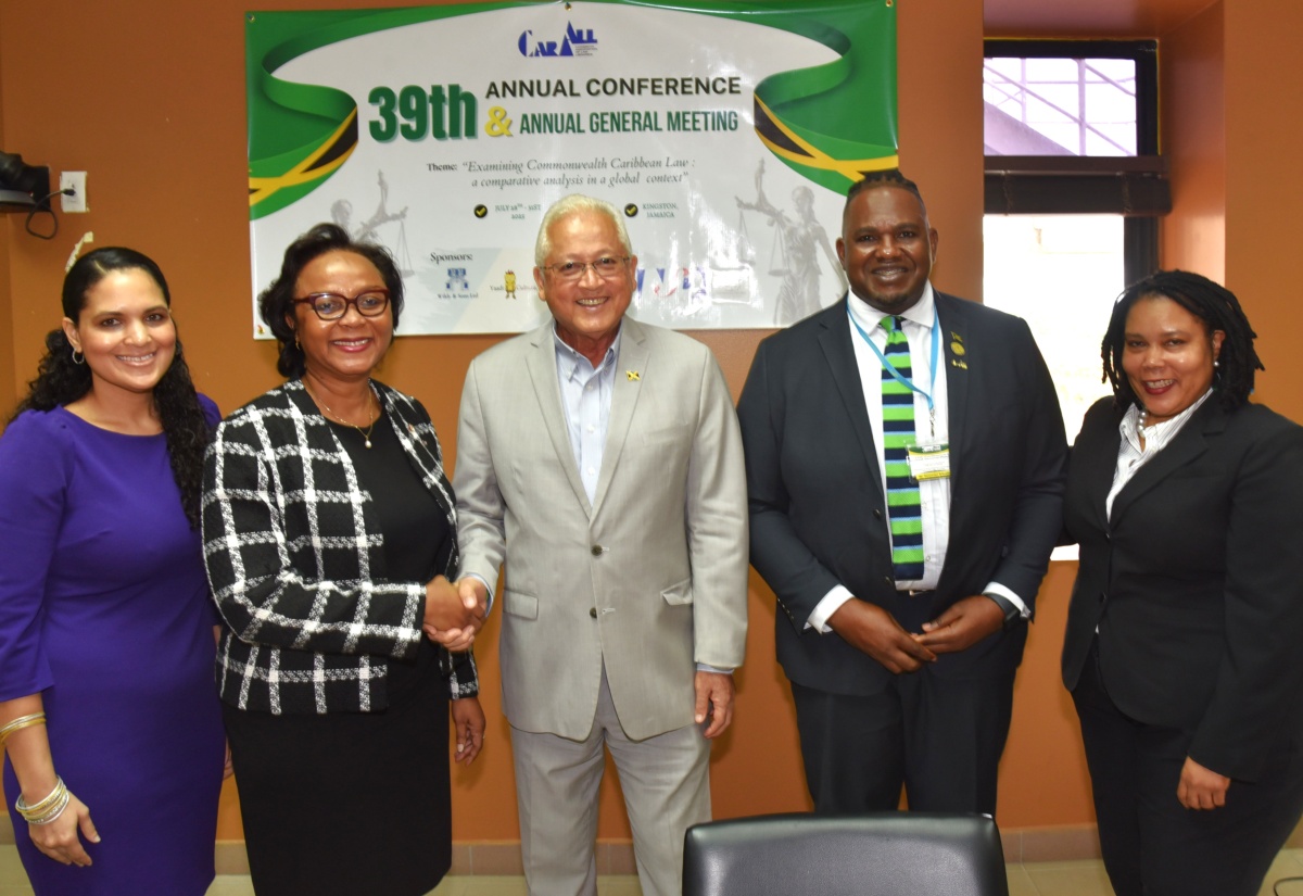 Minister of Justice,  Hon. Delroy Chuck (centre), with (from left) Deputy Solicitor General, Catherine Williams; Senior Puisne Judge, Supreme Court of Jamaica, Hon. Mrs. Justice Lorna Shelly-Williams; Caribbean Association of Law Libraries (CARALL) President, Dwaymian Brissette; and Conference Chairperson, Nicole Walters Wellington. The event was the opening ceremony for the 39th CARALL hybrid Conference and Annual General Meeting, on Monday (July 28), at the University of the West Indies, Mona Campus, in Kingston. The Conference is being held from July 28 to 31.