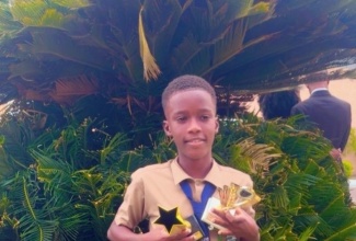 Head Boy at Maverley Primary and Infant School, Tayshawn Graham, who will be going to Jamaica College, displays his trophies at the school, recently.