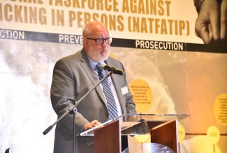 Political and Economic Counsellor at the United States Embassy, George Matthews, gives remarks during the opening ceremony of the Caribbean Trafficking in Persons (CariTIP) Forum at the Dreams Rose Hall Resort and Spa in Montego Bay, St. James, on Wednesday (July 30).