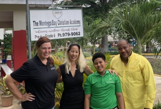 Top boy in the 2025 sitting of the Primary Exit Profile (PEP) exam, Myles Whittingham (third left), is flanked by (from left) Principal of Montego Bay Christian Academy, Renee Winkler; Mother, Serena Lue-Whittingham; and Father, Maurice Whittingham. 