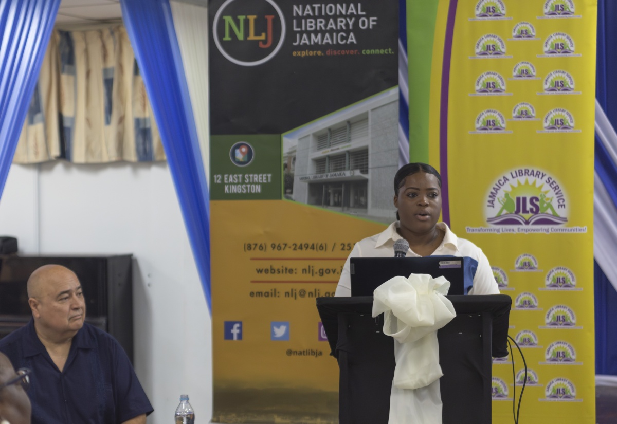 Jamaica Libraries and Information Network (JAMLIN) Development Manager, Jasheka Robinson, delivers remarks during a Disaster Management Workshop, which was held at the Kingston and St. Andrew Parish Library on Monday (June 30). At left is workshop facilitator, Dr. Roberto Rivera. The workshop was held to highlight the critical role of libraries as safe spaces for families and communities during natural disasters.

