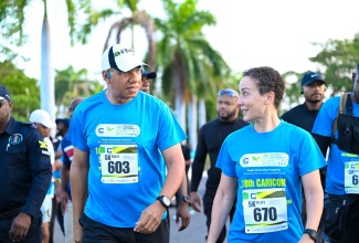 Jamaica’s Prime Minister and Chairman of the Caribbean Community (CARICOM), Dr. the Most. Hon. Andrew Holness, converses with Minister of Foreign Affairs and Foreign Trade, Senator the Hon. Kamina Johnson Smith, following their participation in Saturday’s (July 5) 18th CARICOM Road Races in Montego Bay, St. James.
