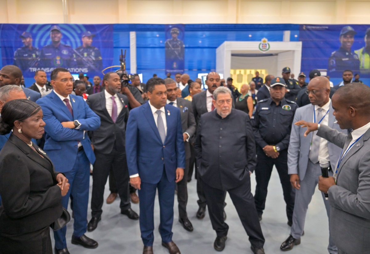 Prime Minister, Dr. the Most Hon. Andrew Holness (second left) and other Caribbean Community (CARICOM) leaders, listen as Jamaica's Commissioner of Police, Dr. Kevin Blake (right), guides a tour of the Jamaica Constabulary Force (JCF) Transformations, People and Quality Technology Expo 2.0 at the Montego Bay Convention Centre in St. James on Sunday (July 6). The exhibition, being held during the 49th Regular Meeting of the Conference of Heads of Government of CARICOM, is showcasing various initiatives and innovations used in fighting crime.