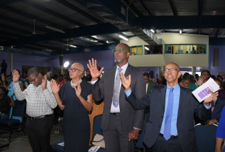 Minister of Finance and the Public Service, Hon. Fayval Williams (second left), along with (from left) Chief Public Policy Officer, Public Procurement Commission, Jovell Barrett; Member of Parliament, St. Catherine South Eastern, Robert Miller, and Chairman, Public Procurement Commission, Milverton Reynolds, participate in the agency’s fifth anniversary thanksgiving service at Celebration Church in Portmore, St. Catherine, on Sunday (July 20).

