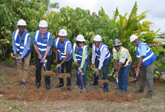 Minister of Agriculture, Fisheries and Mining, Hon. Floyd Green (third left) and Minister without Portfolio in the Office of the Prime Minister with responsibility for Efficiency, Innovation, and Digital Transformation, Senator the Hon. Ambassador Audrey Marks (centre), break ground for the rehabilitation of the Coleyville Cold Storage facility in Manchester on Tuesday (July 29). They are joined by (from left) Councillor for the Craighead Division, Omar Miller; Member of Parliament for Manchester North Eastern, Audley Shaw; Managing Director of the Jamaica Social Investment Fund (JSIF), Omar Sweeney; and Contractor, Bryan Ingleston. 