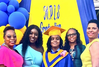 Outstanding former student at Morningside Primary and Infant School in St. Elizabeth, Khaleesi Sinclair (centre) is surrounded by (from left) her shadow, Venecia Williams; Principal of the school, Nahalia Lynch; her mother, Sherline Bent; and grade-six teacher, Michelle Morgan-Jones, during the recent graduation ceremony held at the institution in St. Elizabeth. Khaleesi, who is visually impaired, will be heading to the Hampton School after acing her Primary Exit Profile (PEP) assessment.

