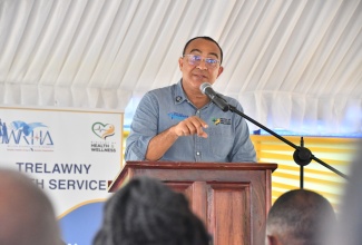 Minister of Health and Wellness, Dr. the Hon. Christopher Tufton, addresses the reopening ceremony for the Jackson Town Health Centre in Trelawny, on Thursday ( July 24).