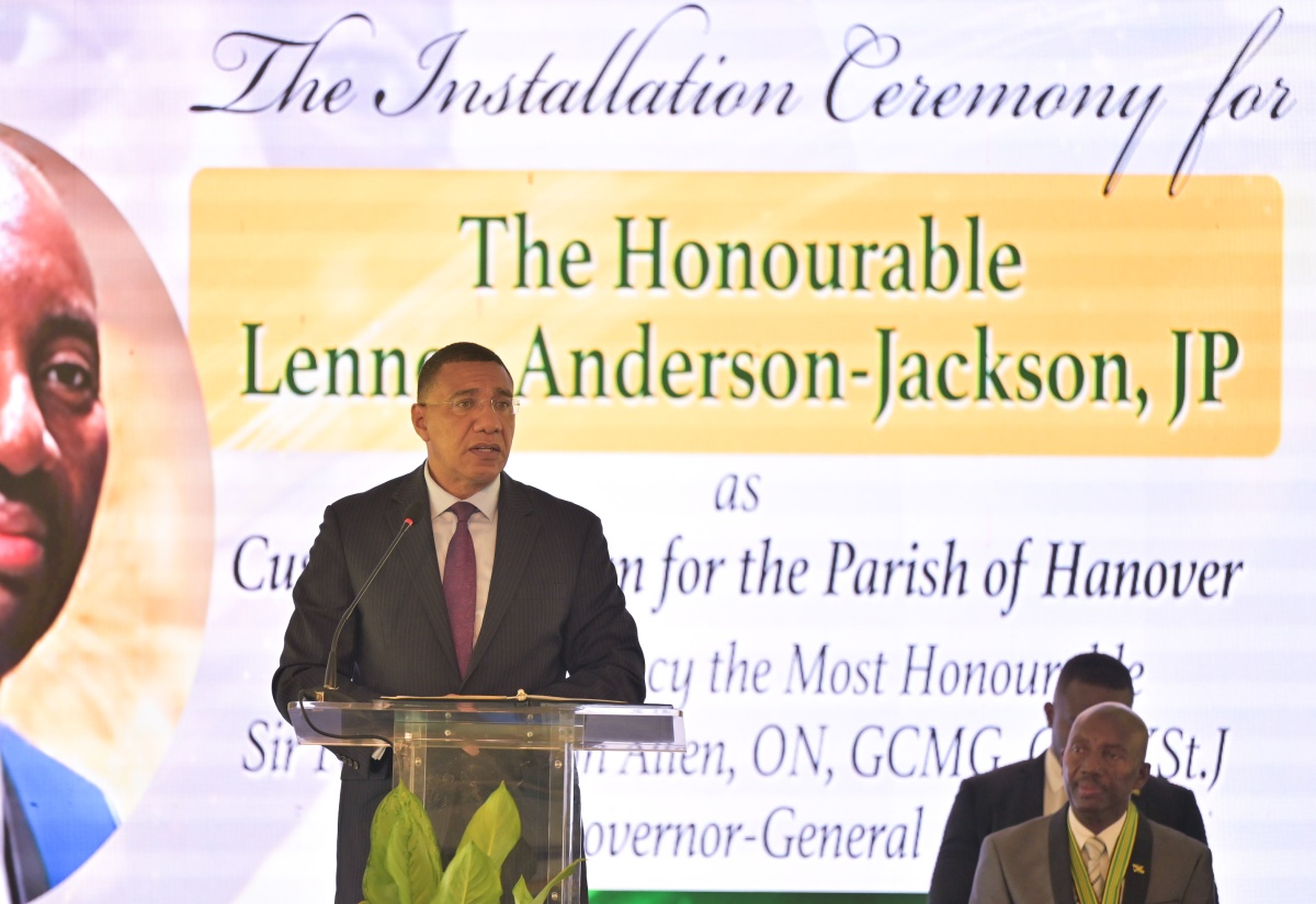 Prime Minister, Dr. the Most Hon. Andrew Holness (left), congratulates the newly installed Custos Rotulorum of Hanover, the Hon. Lennox Anderson-Jackson, during the official installation ceremony held at Rusea