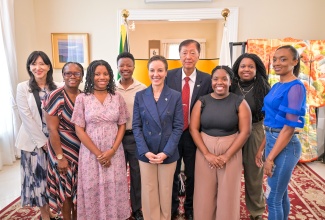 Minister of Foreign Affairs and Foreign Trade, Senator the Hon. Kamina Johnson Smith (centre); Ambassador of Japan to Jamaica, His Excellency, Yasuhiro Atsumi (fourth right) and his wife, Tomoko Atsumi ( left), share a photo opportunity with participants in the Japan Exchange and Teaching (JET) Programme during a send-off reception at the Japanese Ambassador’s Residence, 1 Paddington Terrace in St. Andrew on Thursday (July 24). They are (from second left) Judy-Ann Bailey, Asmahani-Aza Cooke, Amani Cooke, Danelle Matthews, Mikayl Walker, and Christine Day.