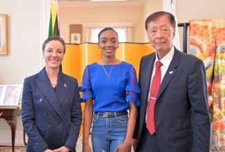Minister of Foreign Affairs and Foreign Trade, Senator the Hon. Kamina Johnson Smith (left), and Ambassador of Japan to Jamaica, His Excellency, Yasuhiro Atsumi (right), share a photo opportunity with Olympian, Christine Day, who has been selected as the first Sports Exchange Advisor (SEA) as part of the Japan Exchange and Teaching (JET) Programme. Occasion was a sendoff reception for the 2025 cohort of participants at the Japanese Ambassador’s Residence in St. Andrew on Thursday (July 24).