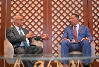 Prime Minister, Dr. the Most Hon. Andrew Holness (right), listens as Secretary-General of the Organization of American States (OAS), His Excellency Albert Ramdin, highlights a point, during a courtesy call at the Montego Bay Convention Centre in St. James earlier today (July 6).