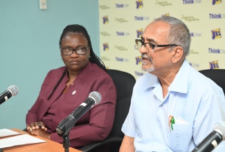 Clinical Coordinator at the Western Regional Health Authority (WRHA), Dr. Delroy Fray (right) addresses a Jamaica Information Service (JIS) Think Tank held at the agency’s regional office in Montego Bay, St. James on July 14. Looking on is WRHA’s Regional Priority Non-Communicable Diseases/Family Health Coordinator, Dr. Marcia Johnson Campbell.
 
