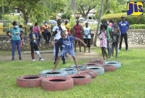 Children engaged in play-based learning during the summer.