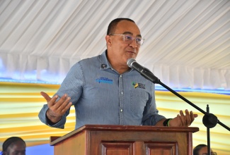 Minister of Health and Wellness, Dr. the Hon. Christopher Tufton, addresses the official reopening ceremony for the Jackson Town Health Centre in Trelawny on July 24.