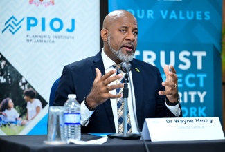 Director General, Planning Institute of Jamaica (PIOJ), Dr. Wayne Henry, addresses Tuesday’s (August 19), Quarterly Press Briefing at the PIOJ’s Oxford Road offices in Kingston.

