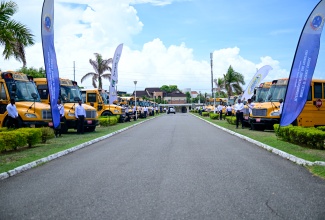 Several school buses pictured on the lawns of Jamaica House for a Blessing Ceremony for the National Rural School Bus Programme on Wednesday (August 27).


