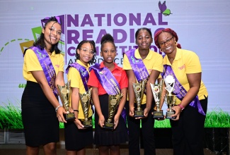 The 2025 National Reading Competition champions display their trophies during Thursday’s (August 28) awards ceremony, held at The Jamaica Pegasus hotel in New Kingston. They are (from left) St. Mary’s Sherene Ramdon (15-20 age group); St. Elizabeth’s Ladonia Rowe (9-11 age group); St. Ann’s Mia-Isabel Walker (6-8 age group); Manchester’s Kristen Lewis (12-14 age group), and St. James’ Henrietta Richards (21 and older age group), who is also the overall winner.