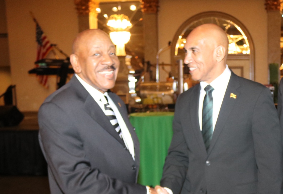 Jamaica’s Ambassador to the United States, His Excellency Major General (Ret’d) Antony Anderson (right), is greeted by President of the Jamaica Association of Maryland, Rick Nugent, at the association’s Annual Independence Gala and Awards Ceremony, held on Saturday, August 9, in Baltimore.