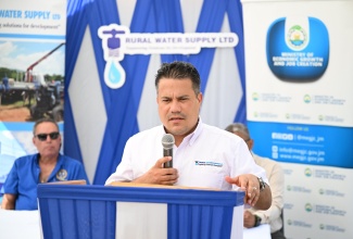 Minister without Portfolio in the Ministry of Economic Growth and Job Creation, Hon. Matthew Samuda, deliver remarks during the commissioning ceremony for the upgraded Cascade Water Supply System in Portland on Wednesday (August 20). The ceremony was held at Cascade Primary and Infant School. The system was rehabilitated at a cost of $40 million and is expected to benefit approximately 550 households in the communities of Cascade and Section in Portland.

