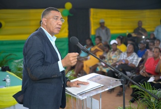 Prime Minister, Dr. the Most Hon. Andrew Holness delivers the keynote address during a Housing Agency of Jamaica (HAJ) ceremony to handover titles in Naseberry Villa, St. Catherine on Tuesday (August 5).