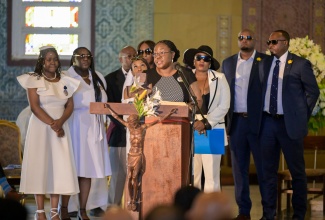  Children of the late Jamaican boxer, Michael McCallum, pay tribute to their father, during his thanksgiving service held at the Holy Trinity Cathedral in Kingston on Saturday (Aug. 16). 