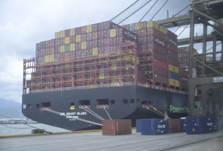Containers with imported goods are being offloaded at the Port of Kingston.

