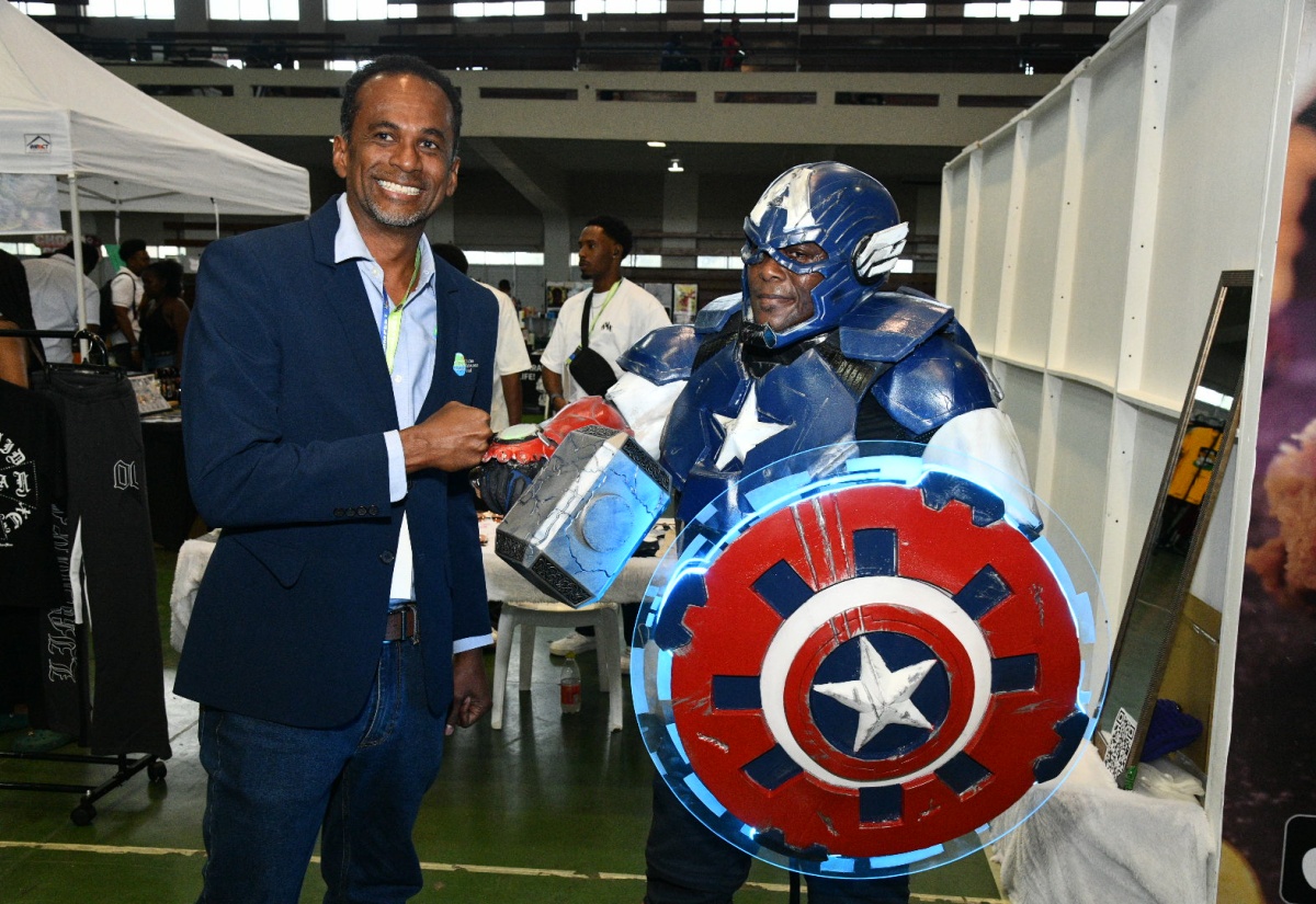 Executive Director of the Tourism Enhancement Fund (TEF), Dr. Carey Wallace (left), with Robert Davis in a Captain America costume at the AnimeCom Fest 2025, held at the National Arena in Kingston on August 10. AnimeCom Fest is Jamaica’s premier convention celebrating animation, cosplay, comics, gaming, film, K-pop, content creation, and cultural diversity. It brings together fans, creators, and industry professionals, while inspiring creativity and innovation among Jamaica’s youth. TEF’s sponsorship reflects its commitment to expanding Jamaica’s cultural and entertainment tourism offerings, creating new economic opportunities, and strengthening the link between tourism and the island’s growing creative industries.

