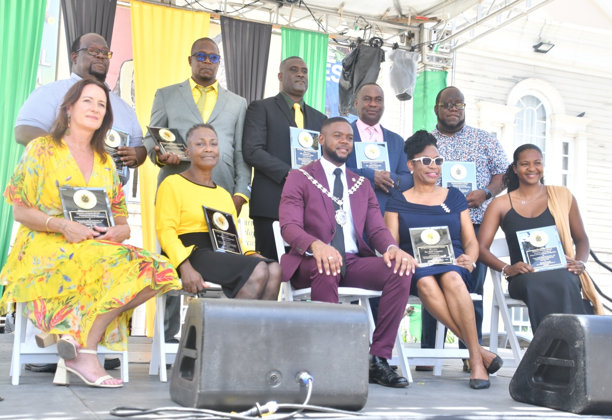 Mayor of Montego Bay, Councillor Richard Vernon (seated, centre), is flanked by the nine citizens who received awards during the Jamaica Cultural Development Commission (JCDC) and the St. James Municipal Corporation’s Independence Flag Raising and Civic Ceremony, held at Sam Sharpe Square in Montego Bay, St. James, on Wednesday (August 6).