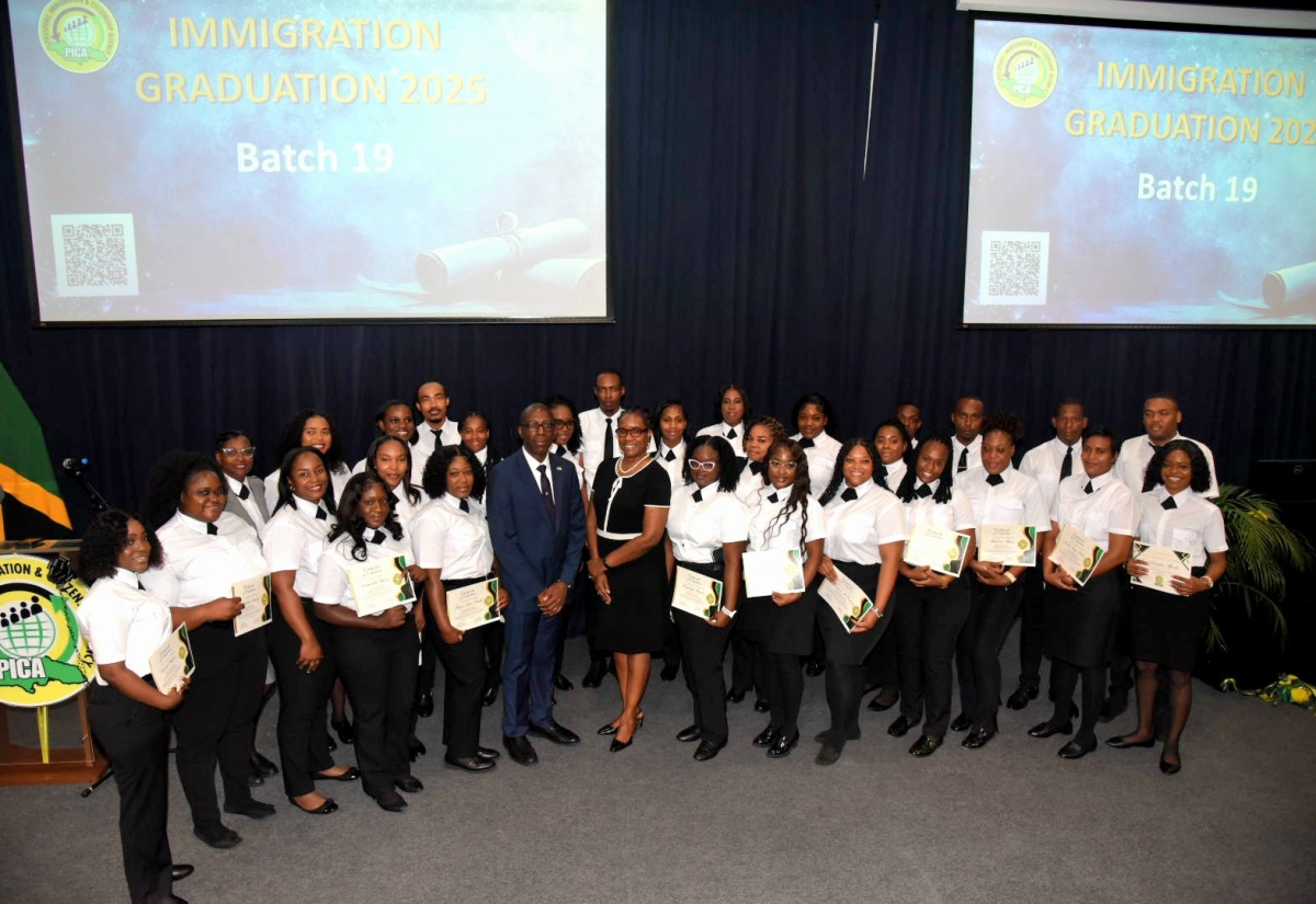 Permanent Secretary in the Ministry of National Security and Chief Immigration Officer, Ambassador Alison Stone Roofe (fourth left, front row), and Chief Executive Officer, Passport, Immigration and Citizenship Agency (PICA), Garth Williams (third left, front row), share a photo opportunity with the 19th batch of immigration officer graduates of PICA’s training programme. The occasion was Thursday’s (August 14) graduation ceremony at the Jamaica Defence Force Caribbean Military Academy, Up Park Camp, Kingston.