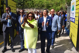 Minister of Culture, Gender, Entertainment and Sport,  Hon. Olivia Grange (centre), celebrates after cutting the ribbon at the reopening of the newly renovated Rockfort Mineral Bath Complex in Kingston, on Thursday (August 21). Also sharing the moment (from left) are Supernumerary Permanent Secretary in the Ministry, Dean-Roy Bernard; MP Candidate for Kingston East and Port Royal, Phillip Paulwell; Managing Director of Caribbean Cement Company Ltd., Jorge Martinez, and Chairman of the Jamaica National Heritage Trust (JNHT), Orville Hill.

