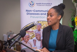 Consultant Gynaecologic Oncologist at the Victoria Jubilee Hospital, Dr. Anna-Kay Taylor-Christmas, addresses the recent launch of the revised National Screening Guidelines for Priority Non-Communicable Diseases in Primary Health Care, held at the Courtyard by Marriott Hotel, in New Kingston.