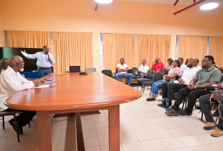 Jamaica Institution of Engineers (JIE) President-Elect, Dr. Balvin Thorpe (standing), speaks during the JIE mentorship programme pilot launch at the University of Technology (UTech) Jamaica in Kingston on Friday (August 22).