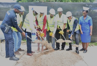 Mayor of Montego Bay, Councillor Richard Vernon (fourth right), breaks ground for the construction of a smart bus stop in Mount Salem, St. James, on Tuesday (August 19). Also participating are (from left), Commanding Officer for the St. James Police Division, Senior Superintendent Eron Samuels; President of Citymove Taxi Association, Conroy Smith; Custos Rotulorum for St. James, Bishop the Hon. Conrad Pitkin; Chief Executive Officer, St. James Municipal Corporation, Naudia Crosskill; Former Mayor of Montego Bay, Leeroy Williams; Regional Director, Western Regional Health Authority (WRHA), St. Andrade Sinclair, and Director of Nursing Services, Cornwall Regional Hospital (CRH), Gillian Ledgister. 

