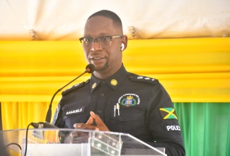 Commanding Officer for the St. James Police Division, Senior Superintendent of Police (SSP) Eron Samuels, delivers remarks during the recent ground-breaking ceremony for a smart bus stop in Mount Salem, Montego Bay. 


