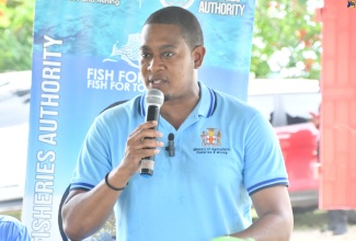 Minister of Agriculture, Fisheries and Mining, Hon. Floyd Green, addresses the handover ceremony for  boats and engines to fishers from St. Elizabeth and Westmoreland, at  the  National Fisheries Authority's (NFA) Black River office, in St. Elizabeth,  on Wednesday (August 13). 