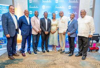 Minister of Tourism, Hon. Edmund Bartlett (3rd right), shares lens time at the 4th Annual American Society of Travel Advisors (ASTA) Caribbean Showcase, at Sandals South Coast, in Westmoreland, on Sunday, August 24.  With the Minister (from left) are: President and CEO of ASTA, Zane Kerby;  Tourism Ministers - Deputy Prime Minister of St Lucia, Hon. Dr. Ernest Hilaire; Hon. Carlos James of St. Vincent & the Grenadines; and Hon. Adrian Thomas from Grenada; Secretary-General and CEO of the Caribbean Tourism Organization, Mrs. Dona Regis-Prosper;  Minister of Tourism for Barbados, Hon. G.P. Ian Gooding-Edghill and Executive VP of Sales & Industry Relations, Unique Vacations, Gary Sadler.

