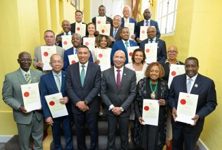 Governor-General, His Excellency the Most Hon. Sir Patrick Allen (front, third right), and Prime Minister, Dr. the Most Hon. Andrew Holness (front, third left), share a photo opportunity with the 18 Cabinet members who were sworn in during a ceremony held at King’s House on Wednesday (September 17).

