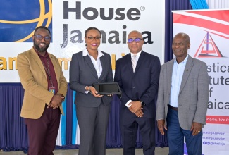 Principal of Cristel House Jamaica, Jason Scott (left); Director General of the Statistical Institute of Jamaica, Leesha Delatie-Budair; Chief Executive Officer of e-Learning Jamaica Company Limited, Andrew Lee (third left), and Custos of Kingston and Board Chairman Cristel House Jamaica, Hon. Steadman Fuller, share a moment at the official launch of the tablet redistribution initiave on August 27.

